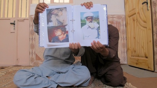 Karim and Sharif Baloch, both of them from Pakistan, show the portraits of their lost brother and father at their current residence in Zaranj. They tell IPS their relatives were killed in 2011 during a Pakistani military operation. Credit: Karlos Zurutuza/IPS